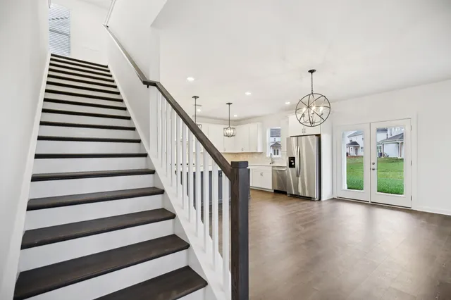a view of an entryway with wooden floor
