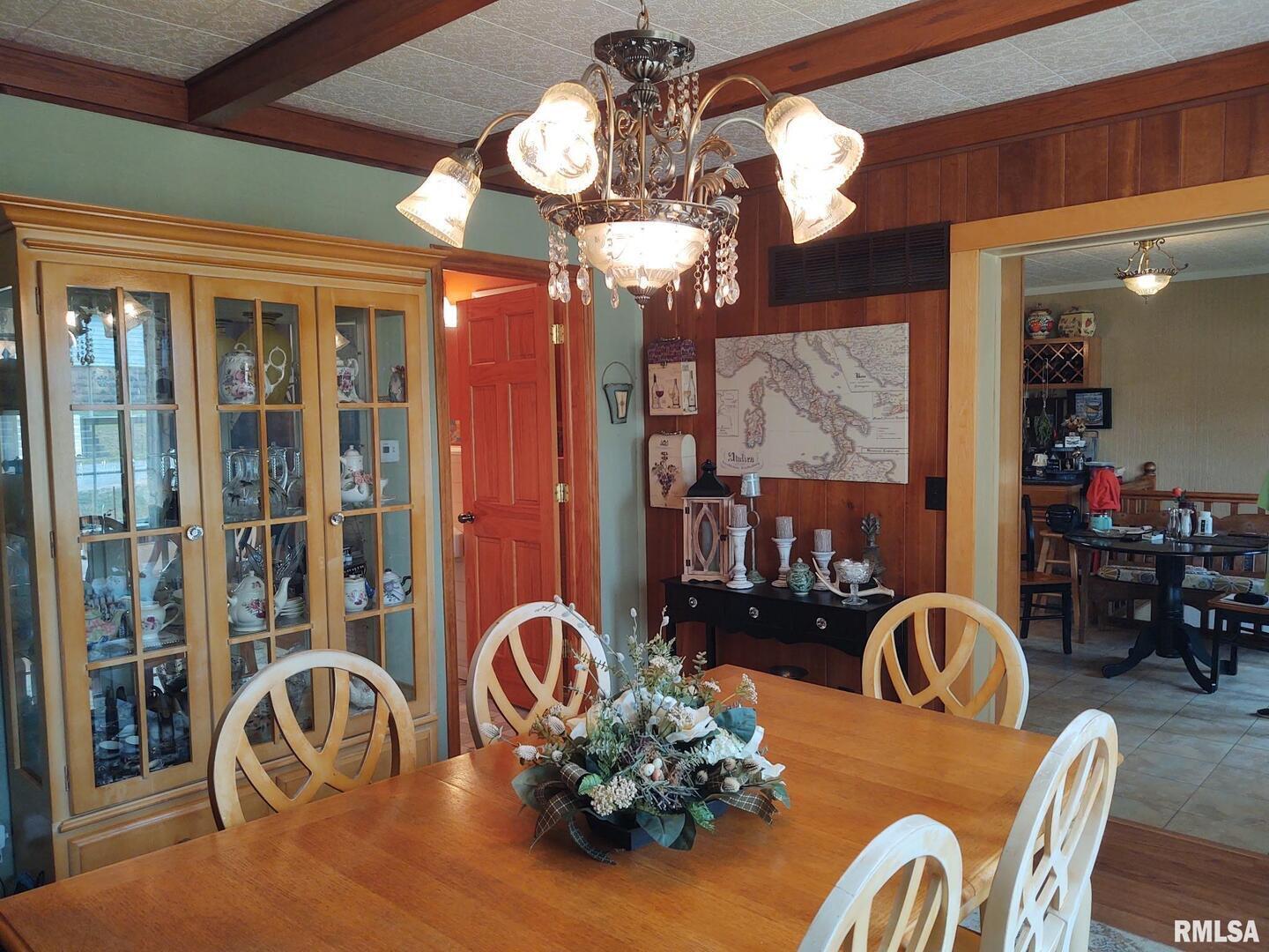 601 Ohio Street Grand Chain, IL 62941 - Photo 12 of 32 a dining room with furniture a chandelier and wooden floor