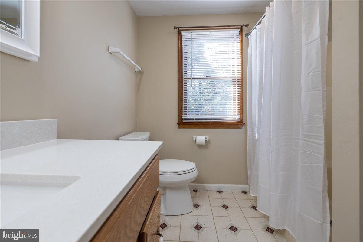 563 Deep Run Road Perkasie, PA 18944 - Photo 17 of 61 a bathroom with a sink a toilet and a window
