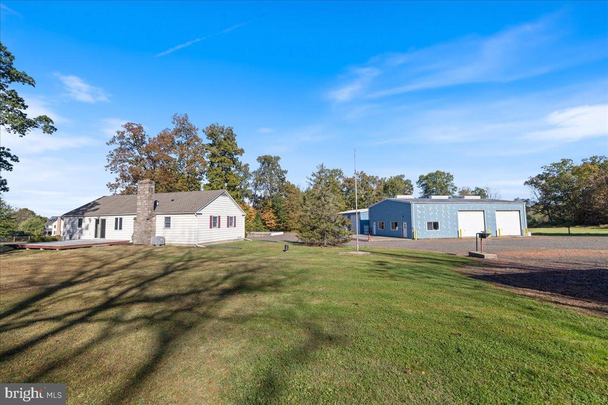 563 Deep Run Road Perkasie, PA 18944 - Photo 28 of 61 a front view of a house with a yard and garage