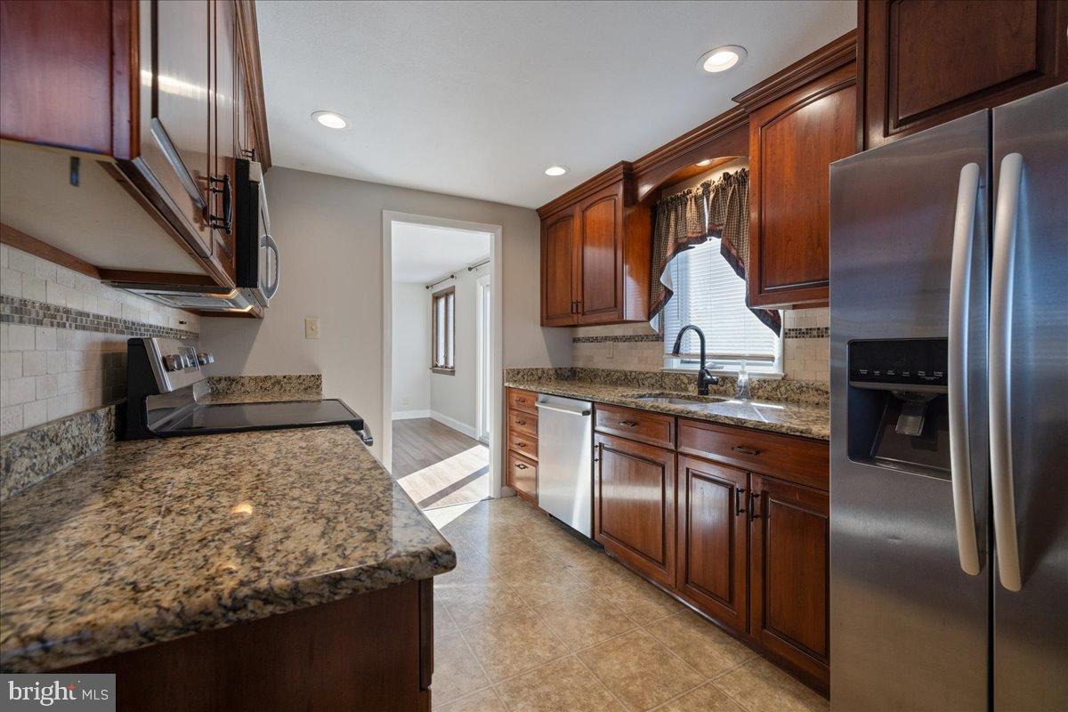 563 Deep Run Road Perkasie, PA 18944 - Photo 9 of 61 Modern kitchen with rich wood accents.
