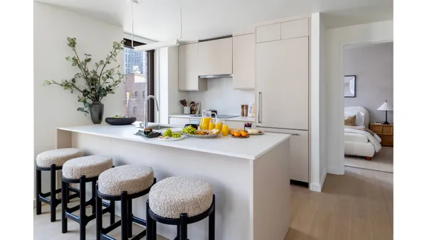 a kitchen with a table and chairs in it