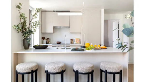 a kitchen with a table chairs and a stove