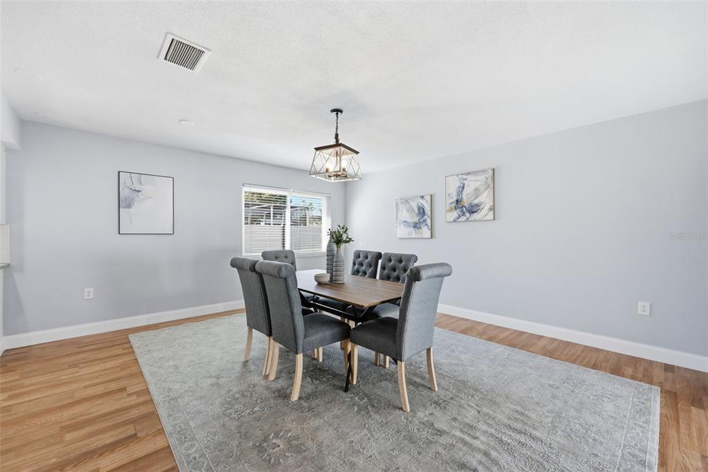 8233 Redfield Drive Port Richey, FL 34668 - Photo 12 of 36 a view of a dining room with furniture and window