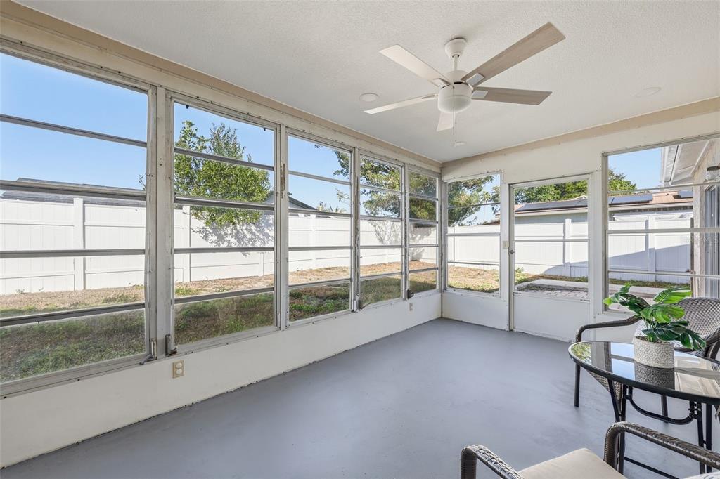 8233 Redfield Drive Port Richey, FL 34668 - Photo 32 of 36 a living room with furniture and a large window