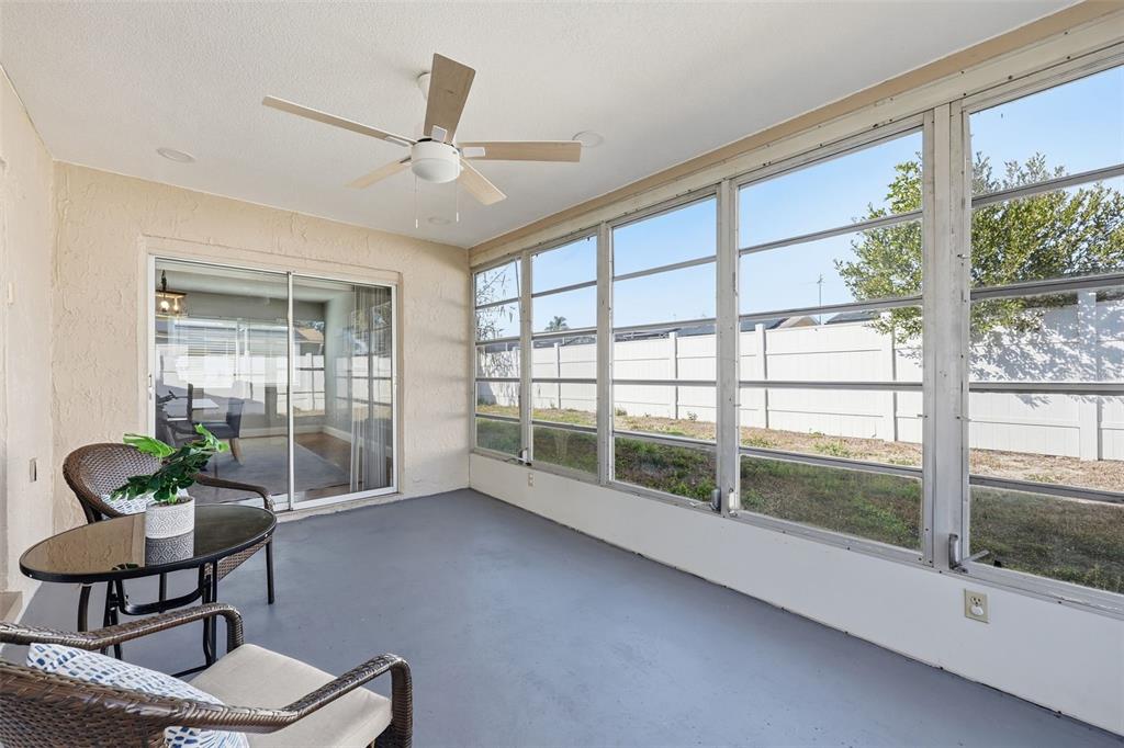 8233 Redfield Drive Port Richey, FL 34668 - Photo 33 of 36 a living room with furniture and a large window