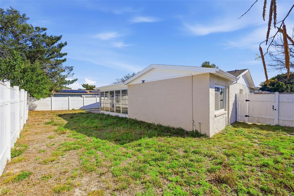 8233 Redfield Drive Port Richey, FL 34668 - Photo 35 of 36 a view of a back yard of the house