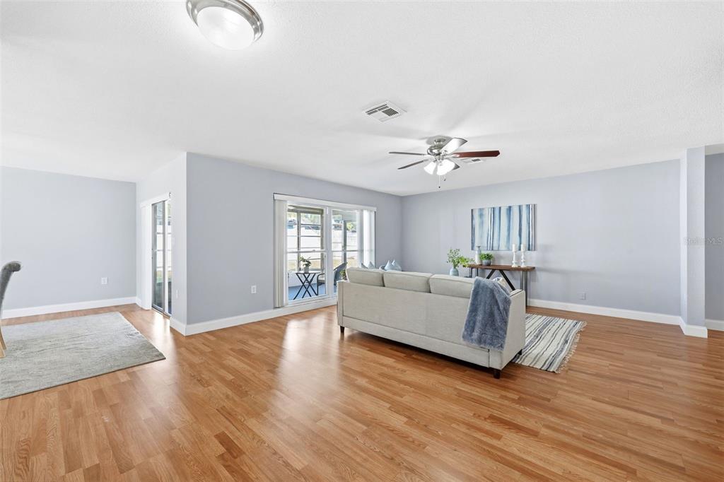 8233 Redfield Drive Port Richey, FL 34668 - Photo 10 of 36 a living room with furniture and a large window