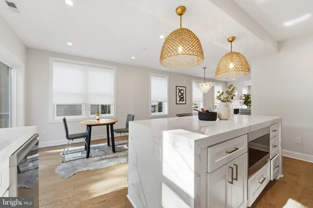 a kitchen with stainless steel appliances white cabinets and a stove