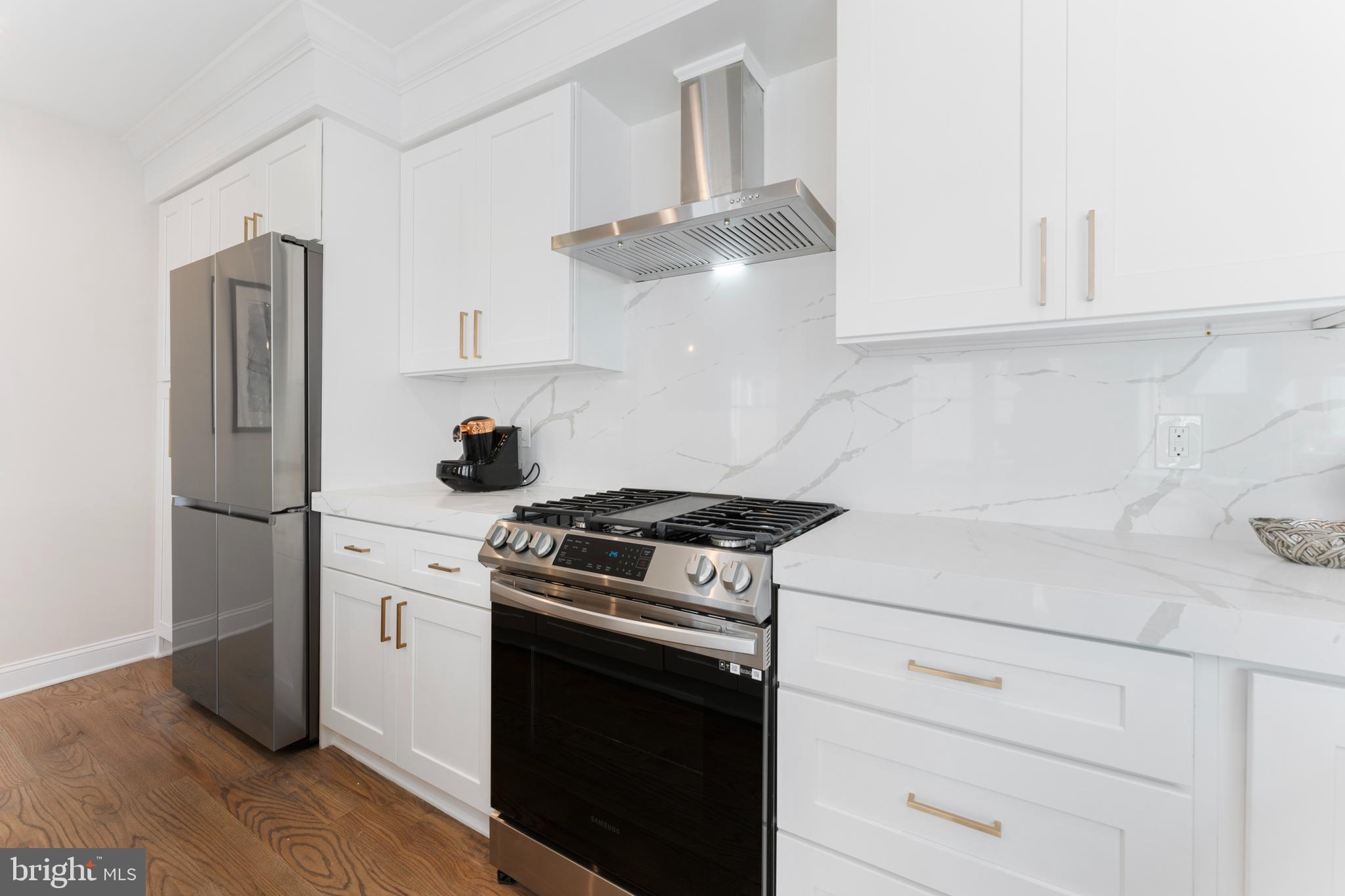 1524 Allison Street Northwest Washington, DC 20011 - Photo 21 of 85 a kitchen with stainless steel appliances white cabinets and a stove