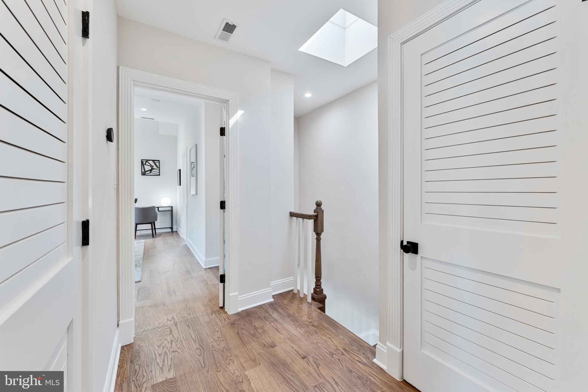 1524 Allison Street Northwest Washington, DC 20011 - Photo 28 of 85 a view of a hallway with wooden floor and staircase