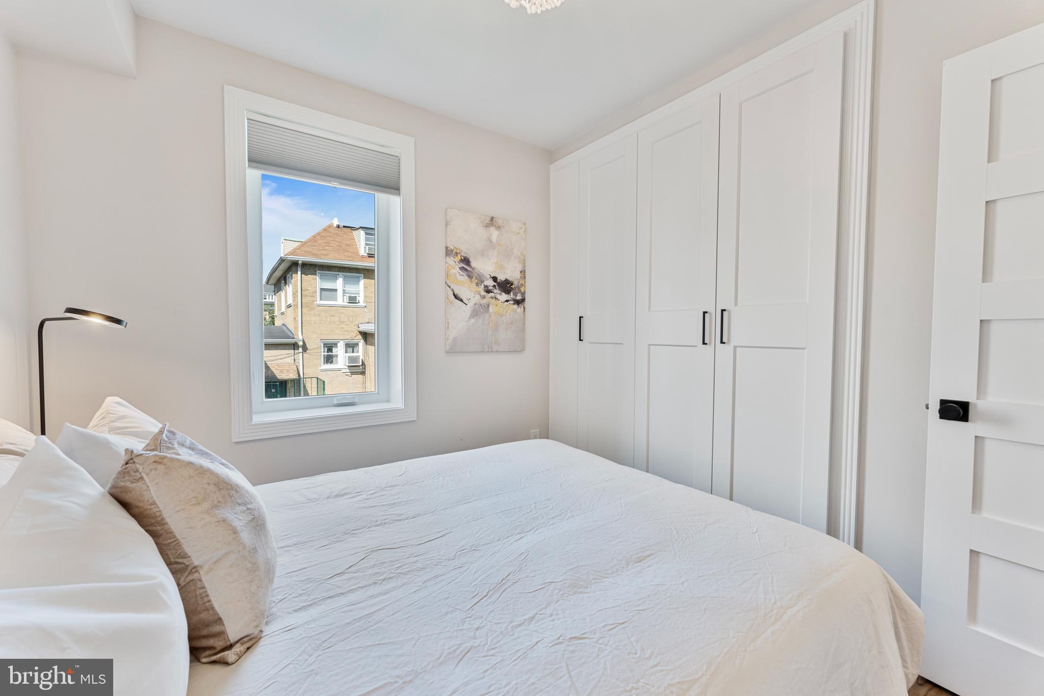 1524 Allison Street Northwest Washington, DC 20011 - Photo 32 of 85 a bedroom with a bed and a window