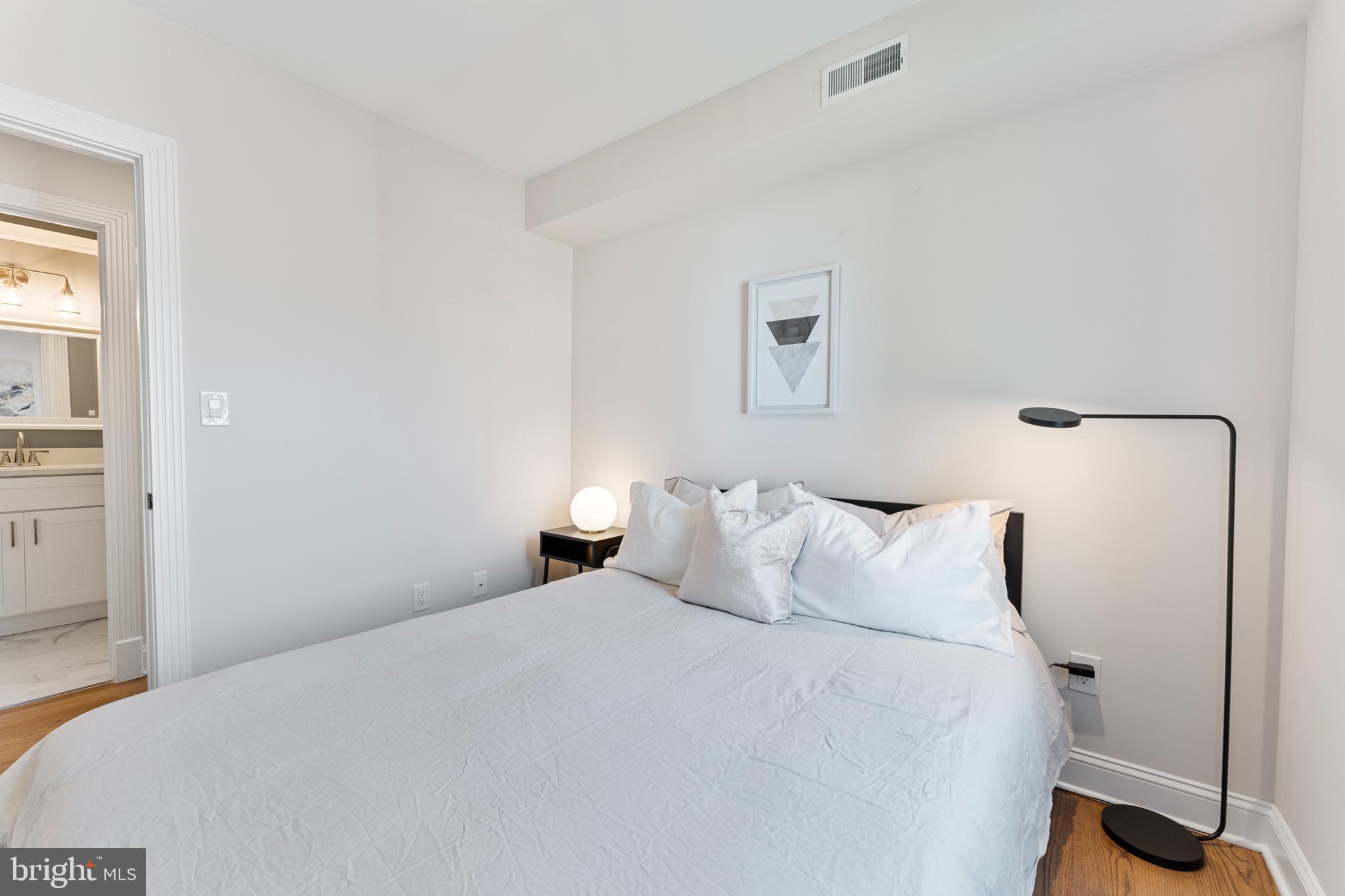 1524 Allison Street Northwest Washington, DC 20011 - Photo 33 of 85 a bedroom with a bed and a window