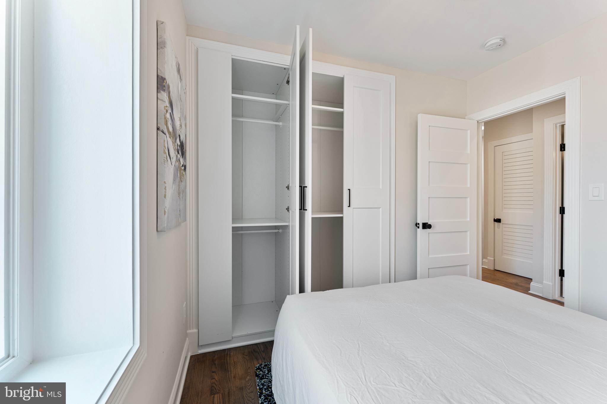 1524 Allison Street Northwest Washington, DC 20011 - Photo 34 of 85 a bedroom with a bed and wooden floor