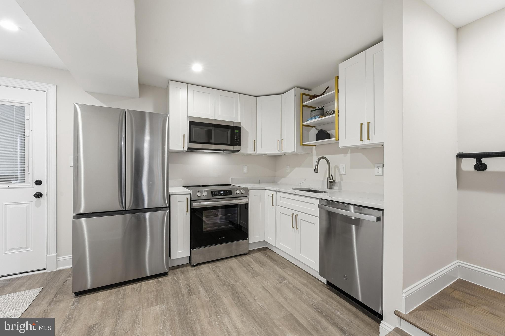 1524 Allison Street Northwest Washington, DC 20011 - Photo 42 of 85 a kitchen with stainless steel appliances granite countertop a refrigerator stove and microwave