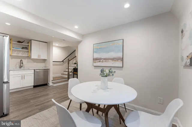 a bedroom with a bed and a night stand