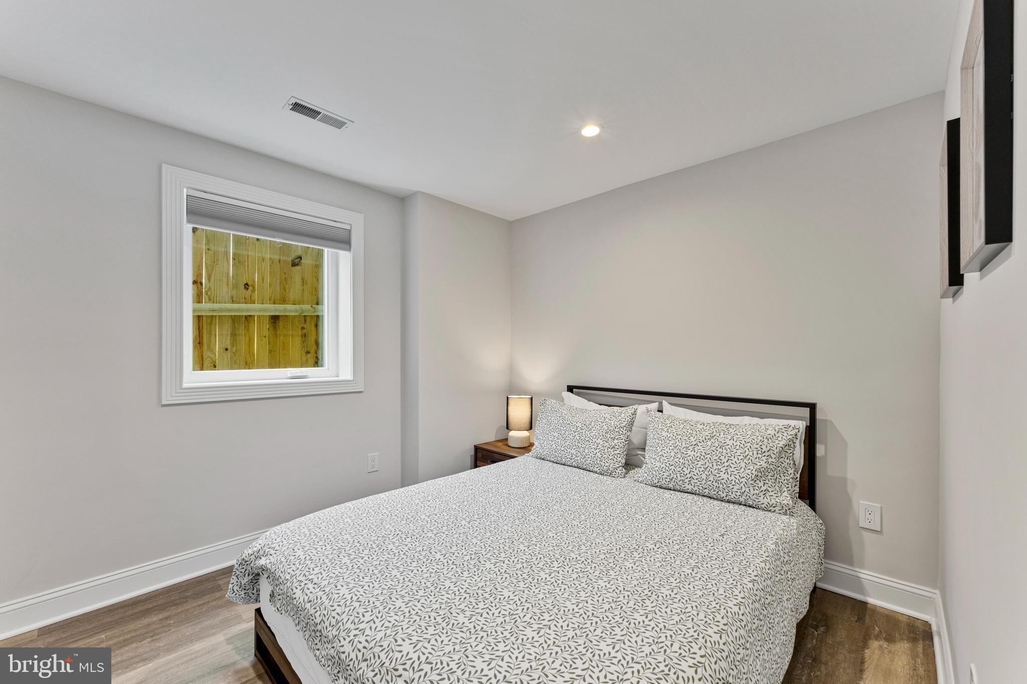 1524 Allison Street Northwest Washington, DC 20011 - Photo 59 of 85 a bedroom with a bed and window