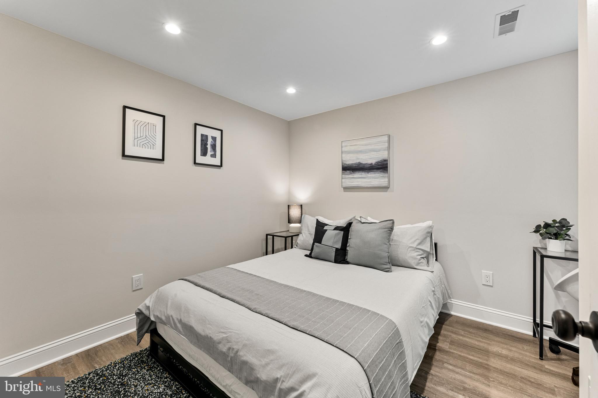 1524 Allison Street Northwest Washington, DC 20011 - Photo 61 of 85 a bedroom with a bed and a night stand