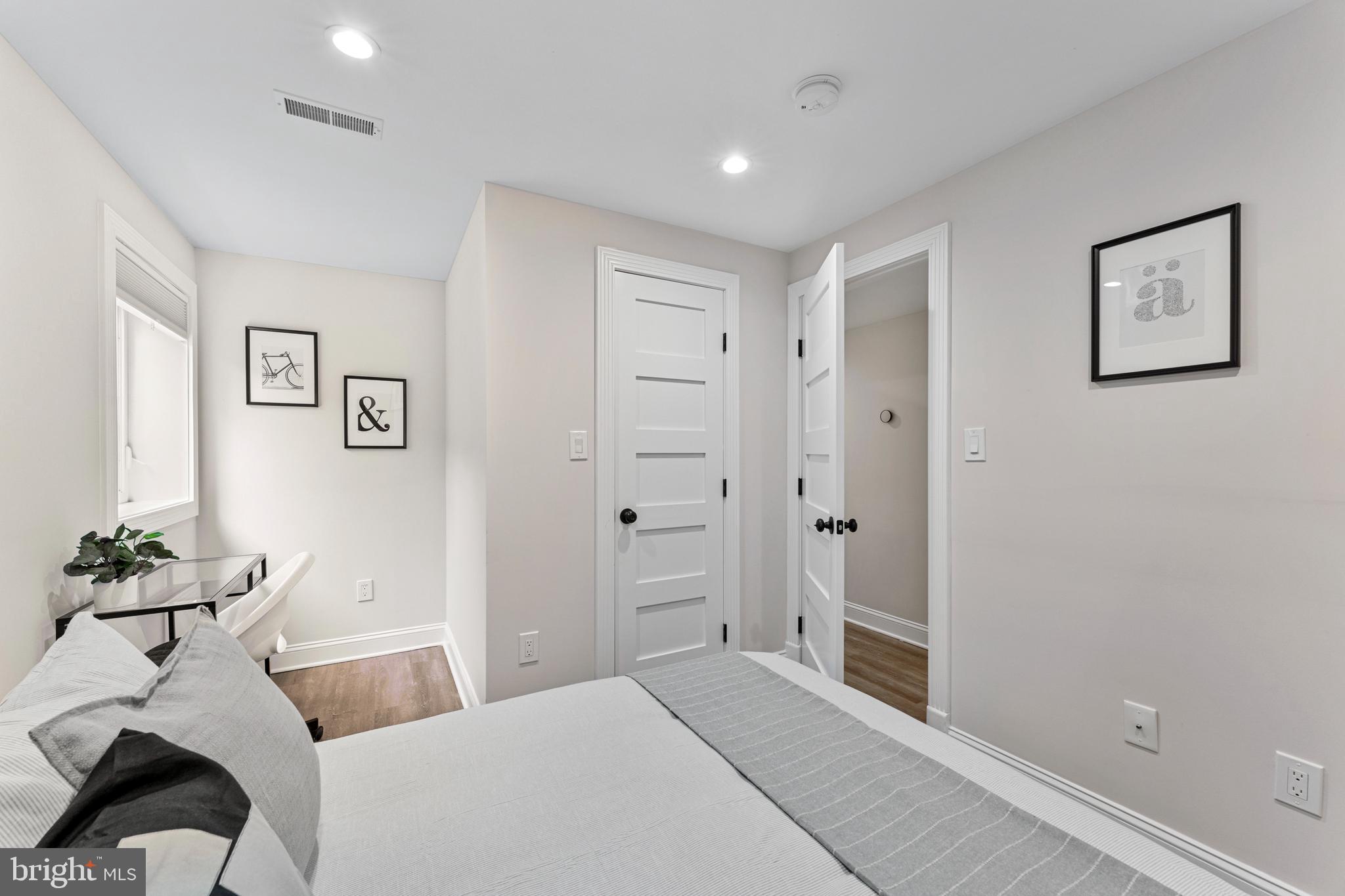 1524 Allison Street Northwest Washington, DC 20011 - Photo 64 of 85 a bedroom with a bed and a window