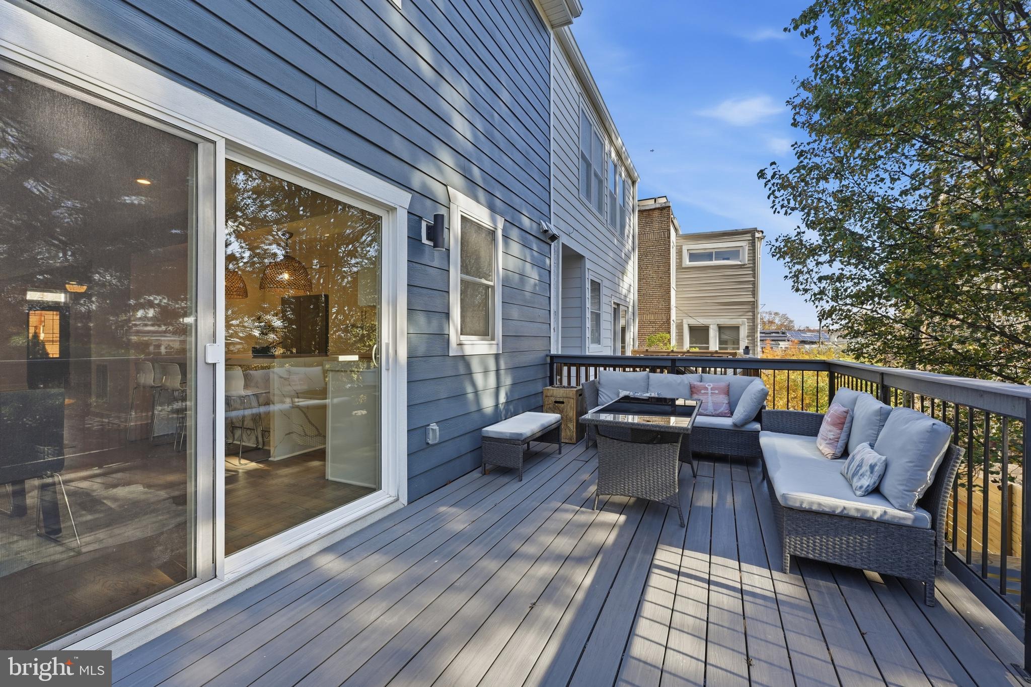 1524 Allison Street Northwest Washington, DC 20011 - Photo 77 of 85 a balcony with furniture and wooden floor