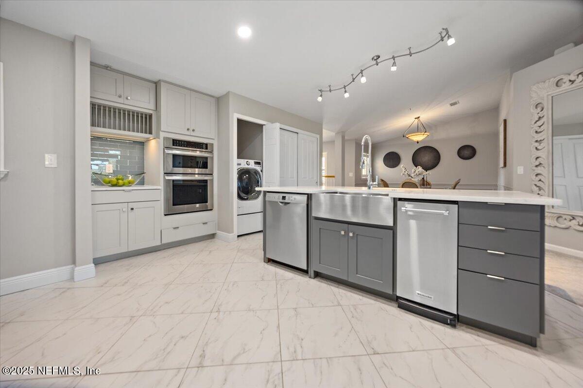 86 Fawn Gully Lane, Unit D Ponte Vedra, FL 32081 - Photo 14 of 29 a open kitchen with a sink and cabinets