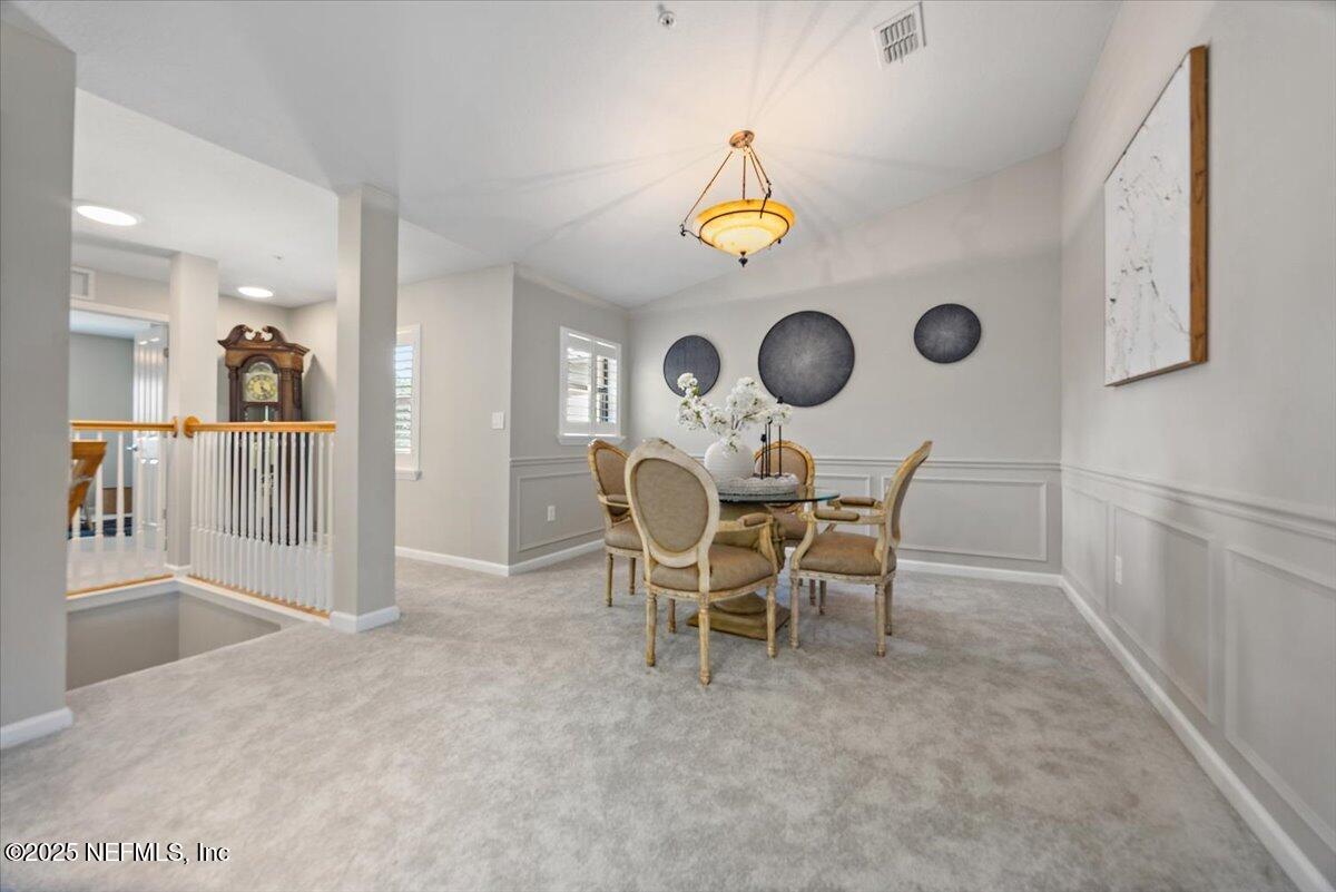 86 Fawn Gully Lane, Unit D Ponte Vedra, FL 32081 - Photo 15 of 29 a view of a dining room with furniture and wooden floor