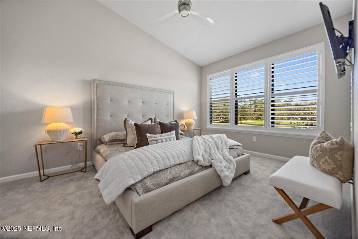 86 Fawn Gully Lane, Unit D Ponte Vedra, FL 32081 - Photo 16 of 29 a spacious bedroom with a bed and a couch