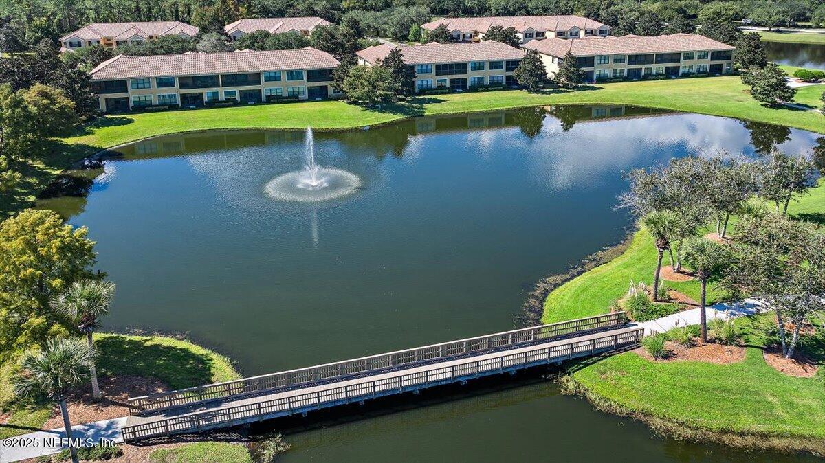 86 Fawn Gully Lane, Unit D Ponte Vedra, FL 32081 - Photo 3 of 29 a view of a lake with a building in the background