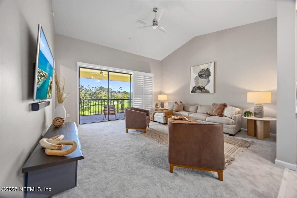 86 Fawn Gully Lane, Unit D Ponte Vedra, FL 32081 - Photo 10 of 29 a living room with furniture and a large window