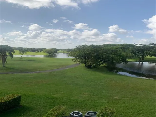 a view of a golf course with a lake
