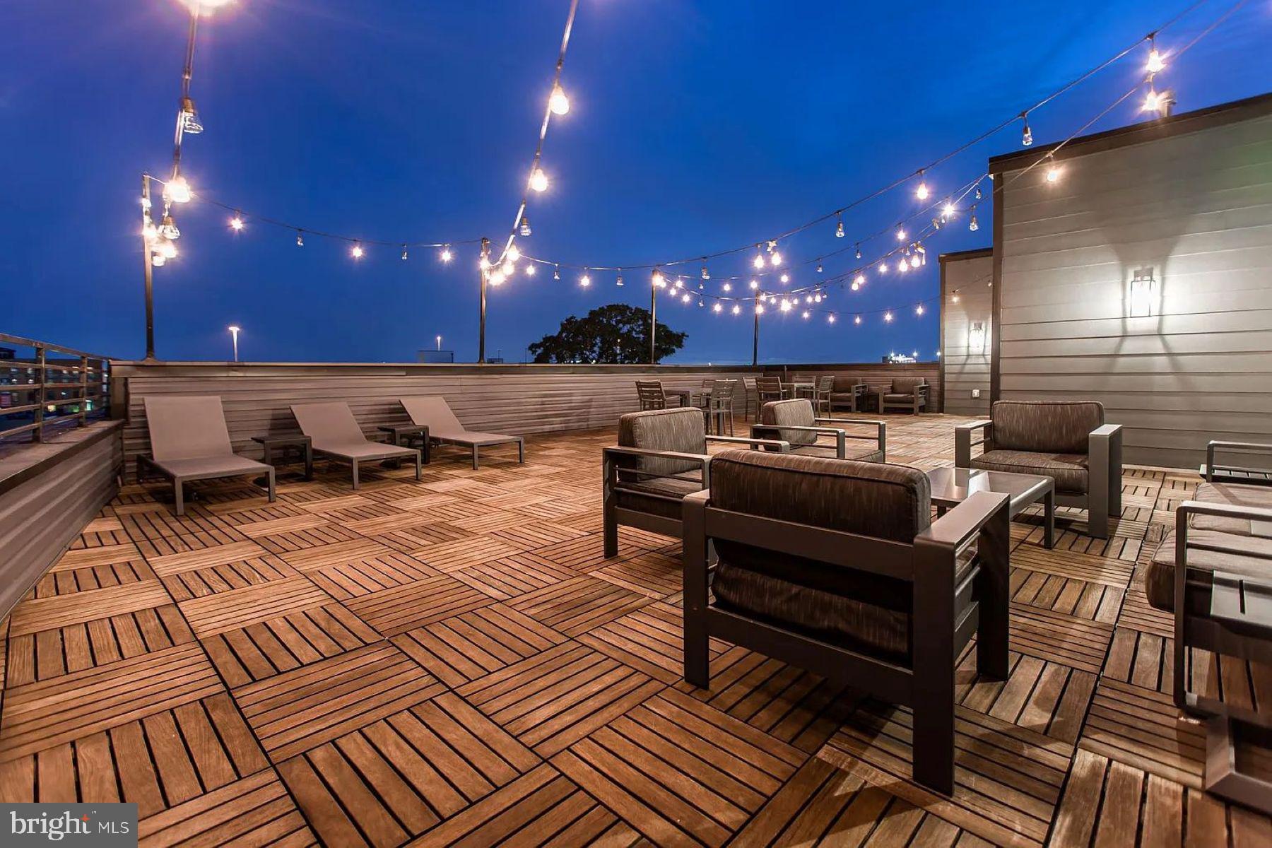 1702 Light Street, Unit 203 Baltimore, MD 21230 - Photo 12 of 14 a outdoor dining space with furniture and a potted plant