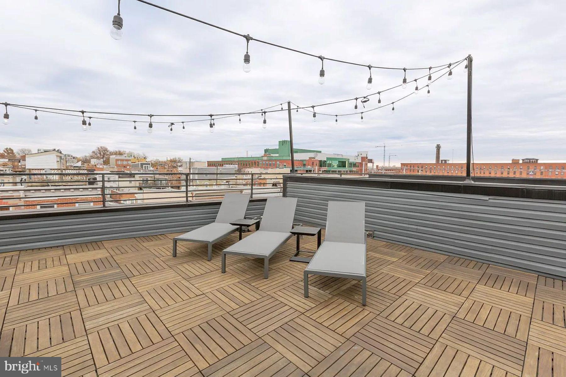 1702 Light Street, Unit 203 Baltimore, MD 21230 - Photo 9 of 14 a view of a terrace with seating space