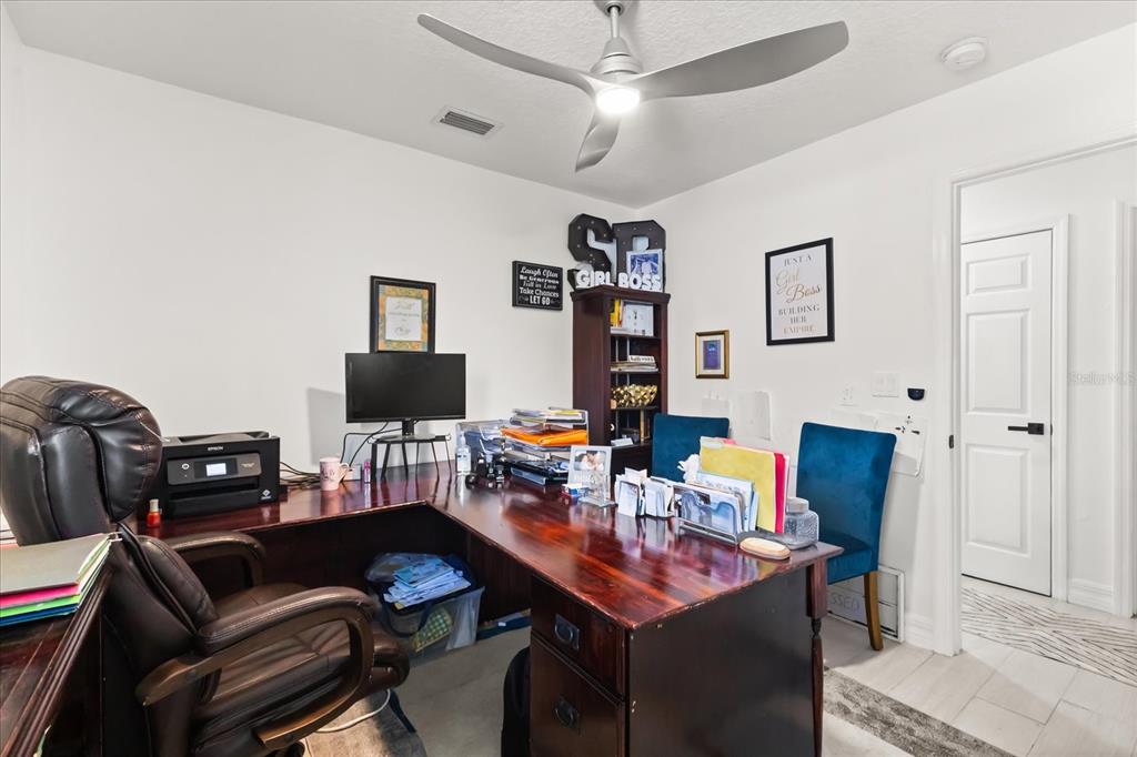 812 Chastain Road Seffner, FL 33584 - Photo 19 of 26 a living room with furniture and a flat screen tv