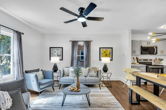 a view of a dining room with furniture and wooden floor