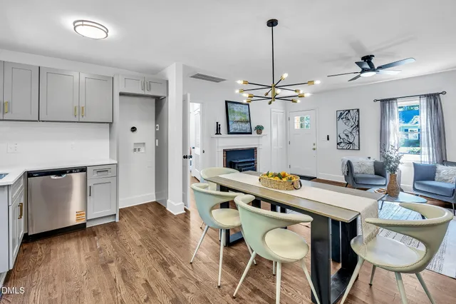 a living room with furniture a rug and a flat screen tv