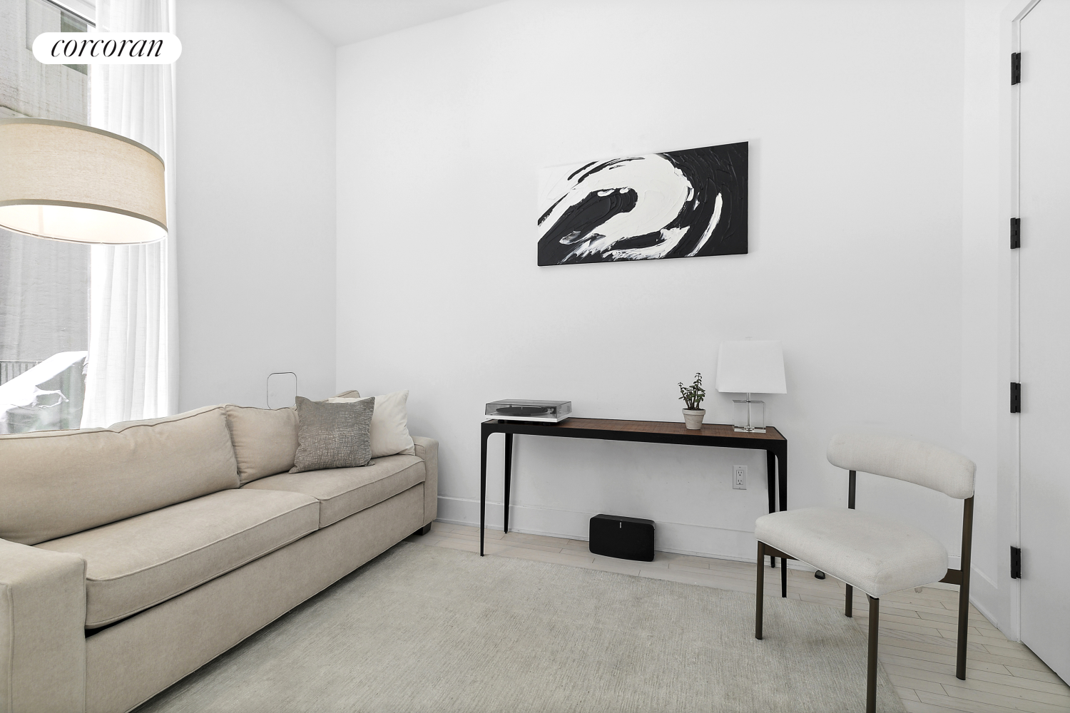 91 Leonard Street, Unit 2E Manhattan, NY 10013 - Photo 5 of 10 a living room with a couch