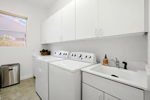a utility room with dryer and washer