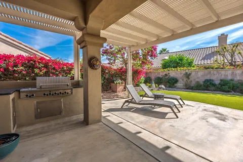 a view of a chairs and tables in patio