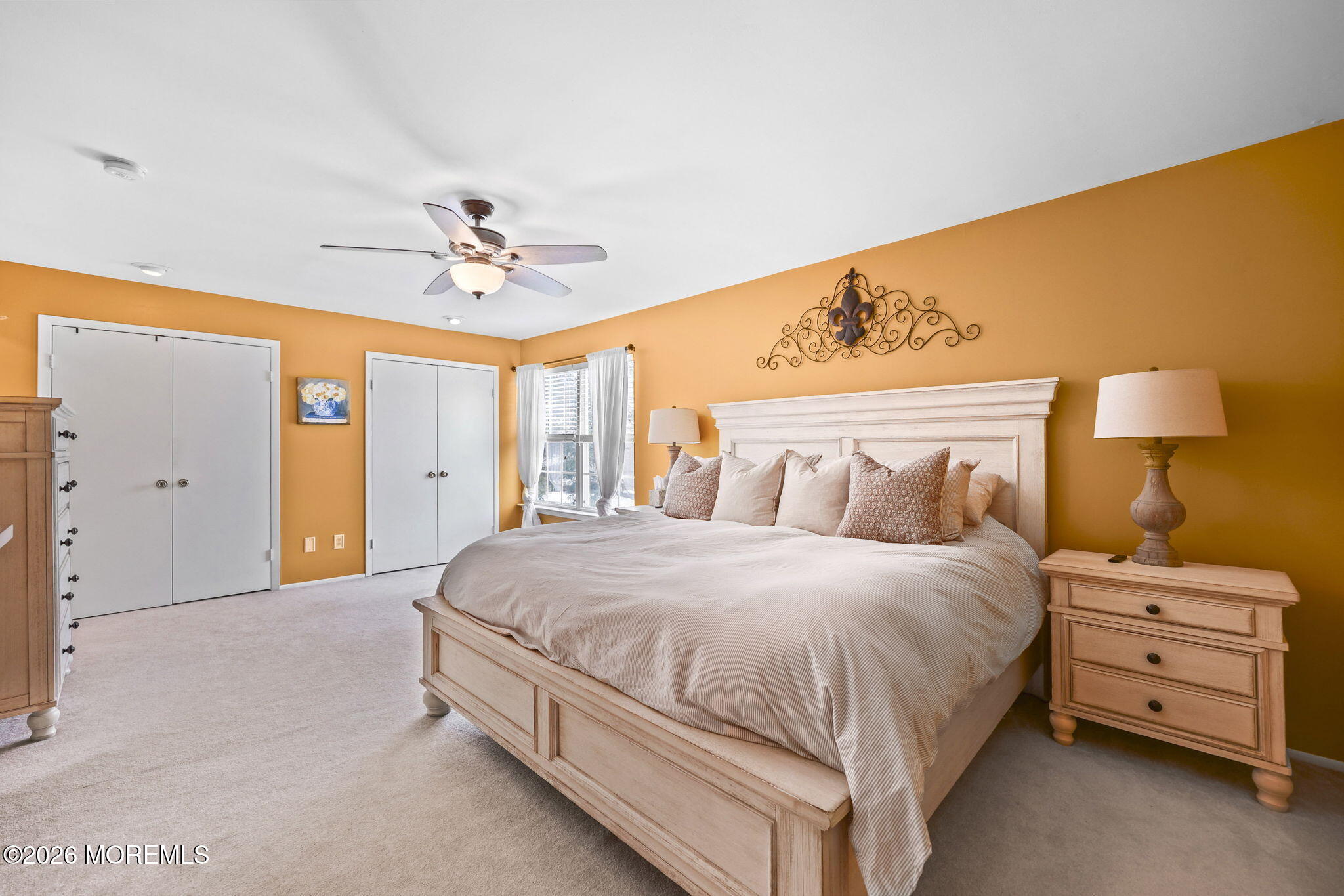 31 Atrium Way, Unit 31 Manalapan, NJ 07726 - Photo 14 of 34 a bedroom with a bed and a chandelier