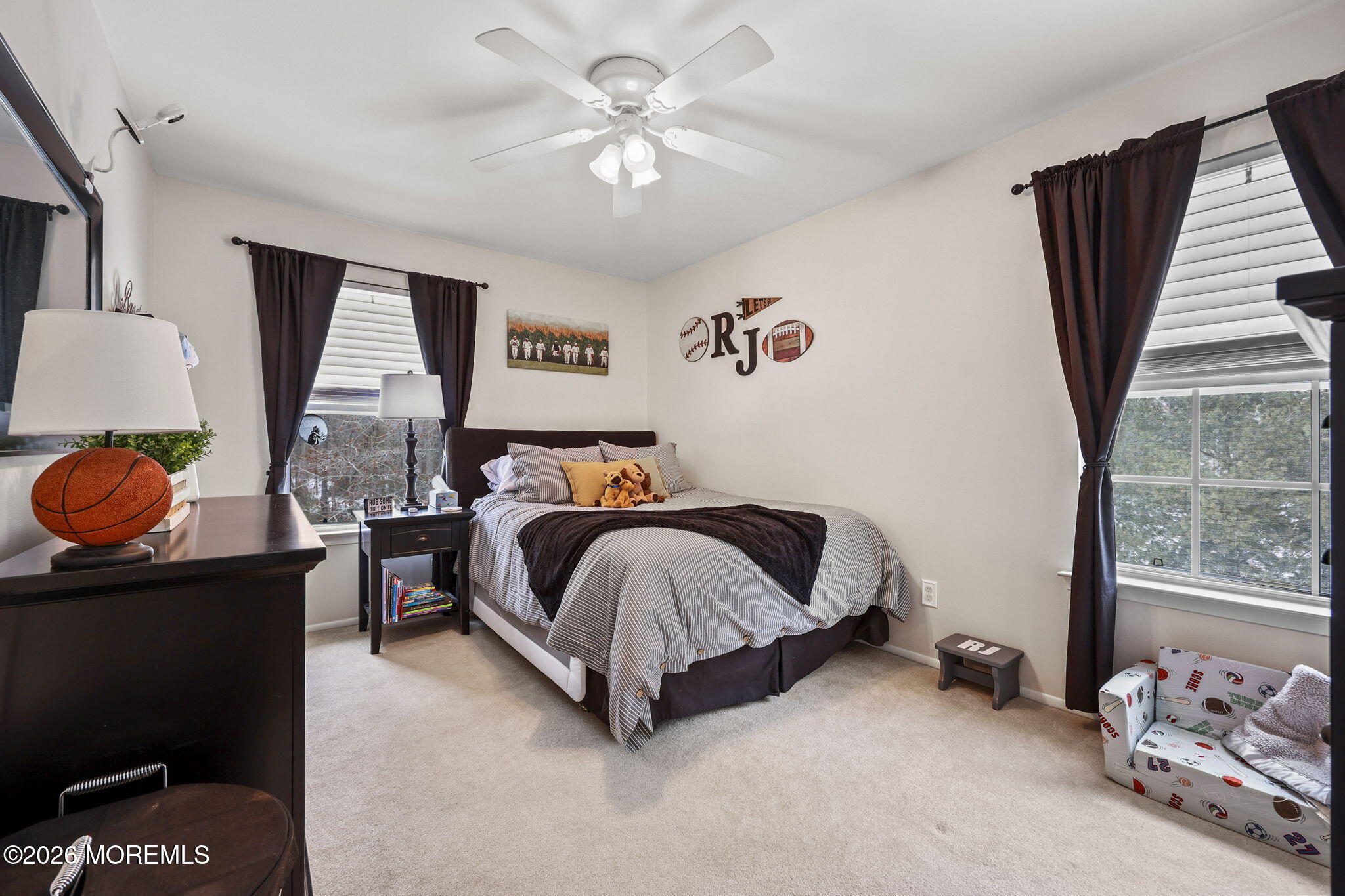 31 Atrium Way, Unit 31 Manalapan, NJ 07726 - Photo 17 of 34 a spacious bedroom with a bed and window