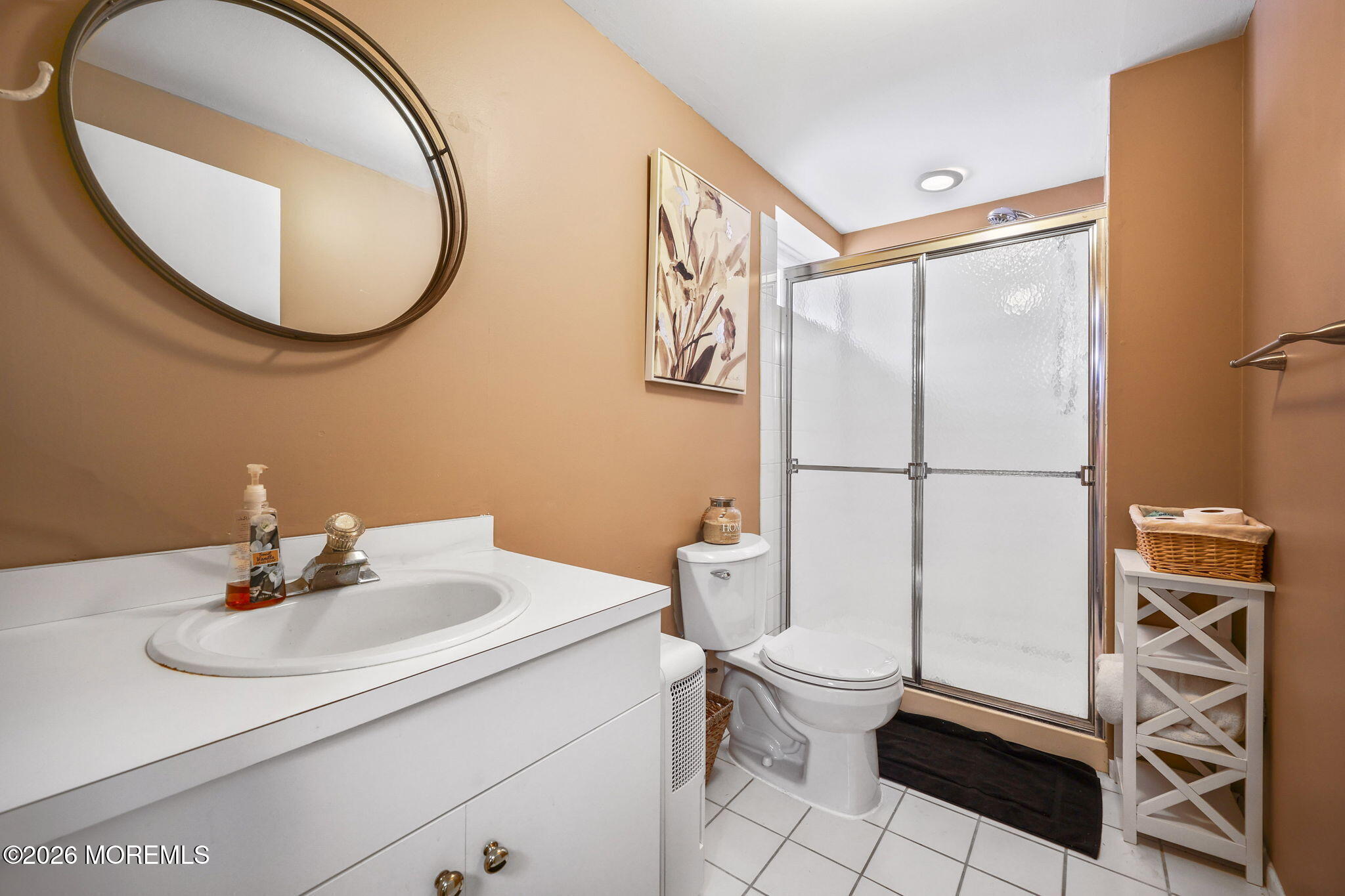 31 Atrium Way, Unit 31 Manalapan, NJ 07726 - Photo 22 of 34 a bathroom with a sink toilet and a mirror