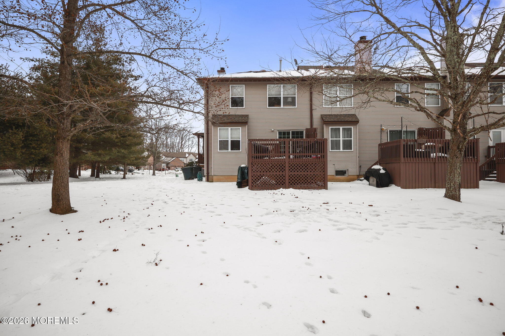 31 Atrium Way, Unit 31 Manalapan, NJ 07726 - Photo 26 of 34 a view of a white house with snow on the road