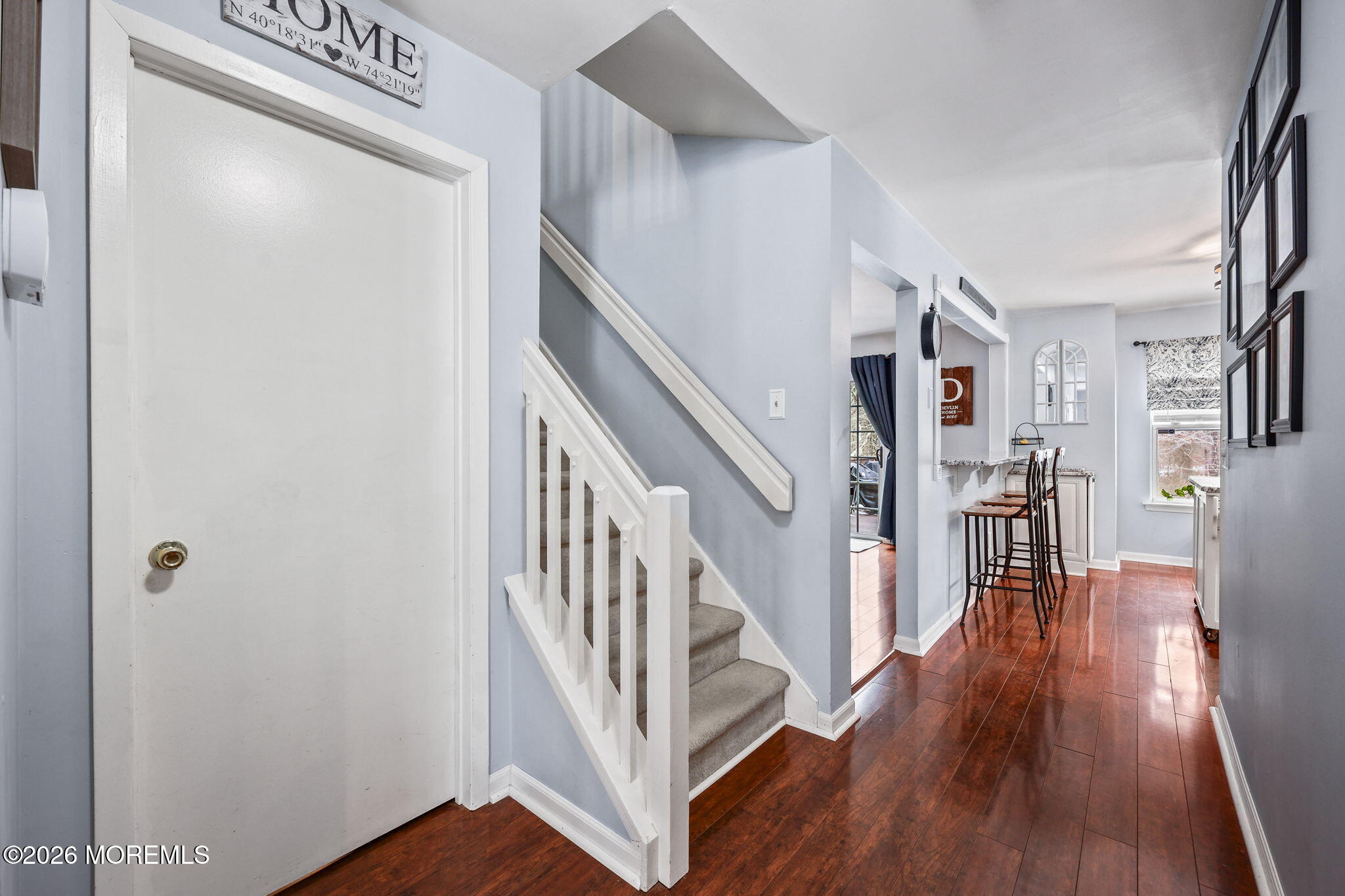 31 Atrium Way, Unit 31 Manalapan, NJ 07726 - Photo 7 of 34 a view of entryway with stairs and wooden floor