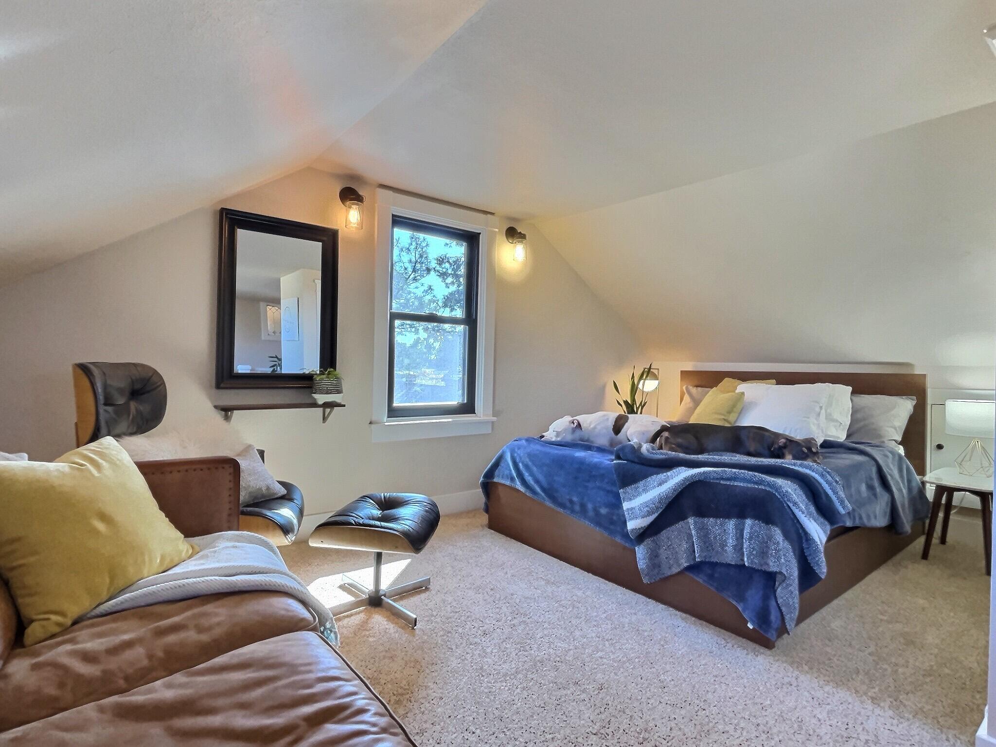 60360 Horse Butte Road Bend, OR 97702 - Photo 25 of 58 a bedroom with a bed and window