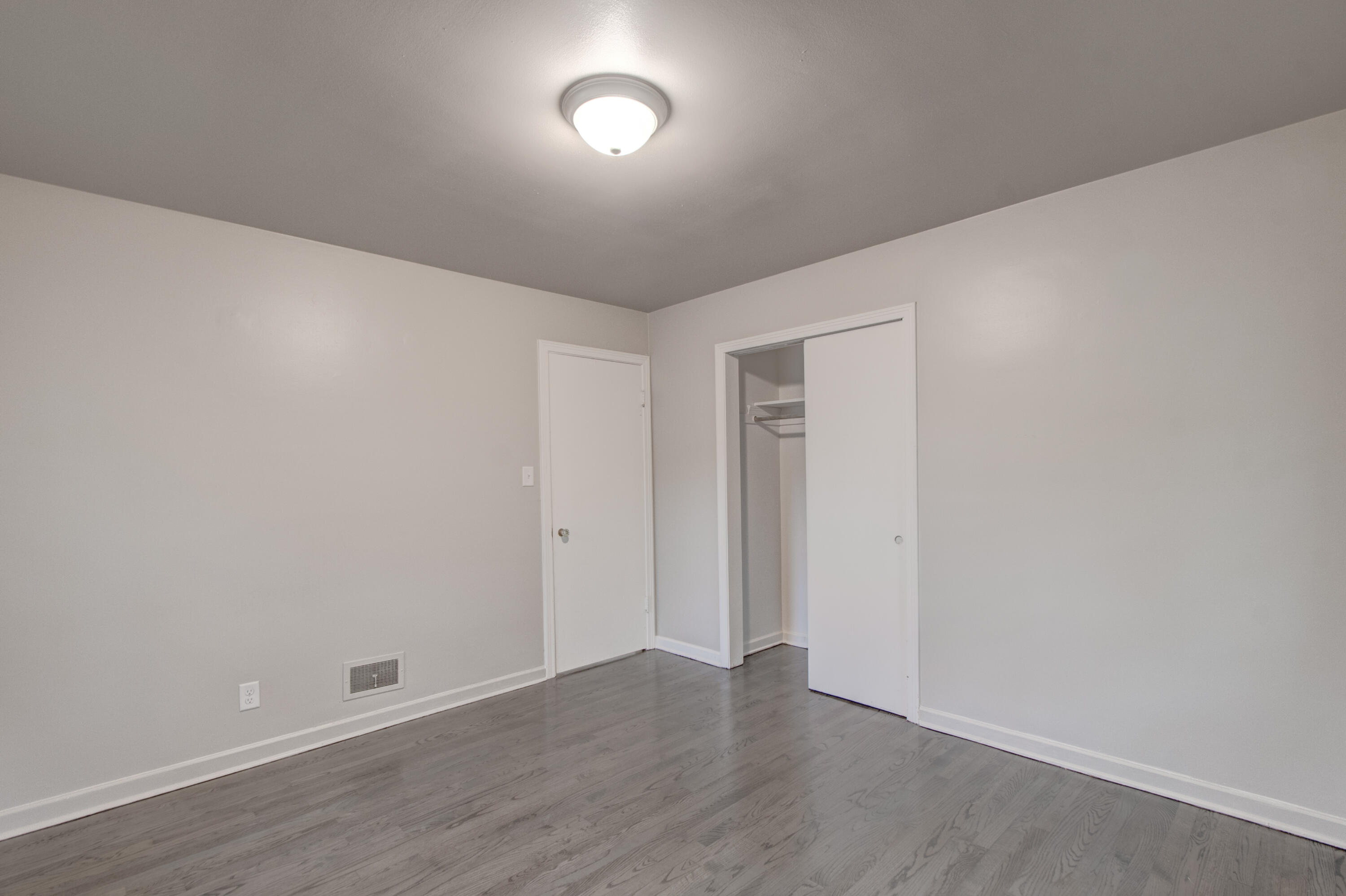 4727 Harrison Street Gary, IN 46408 - Photo 12 of 15 a view of an empty room with wooden floor