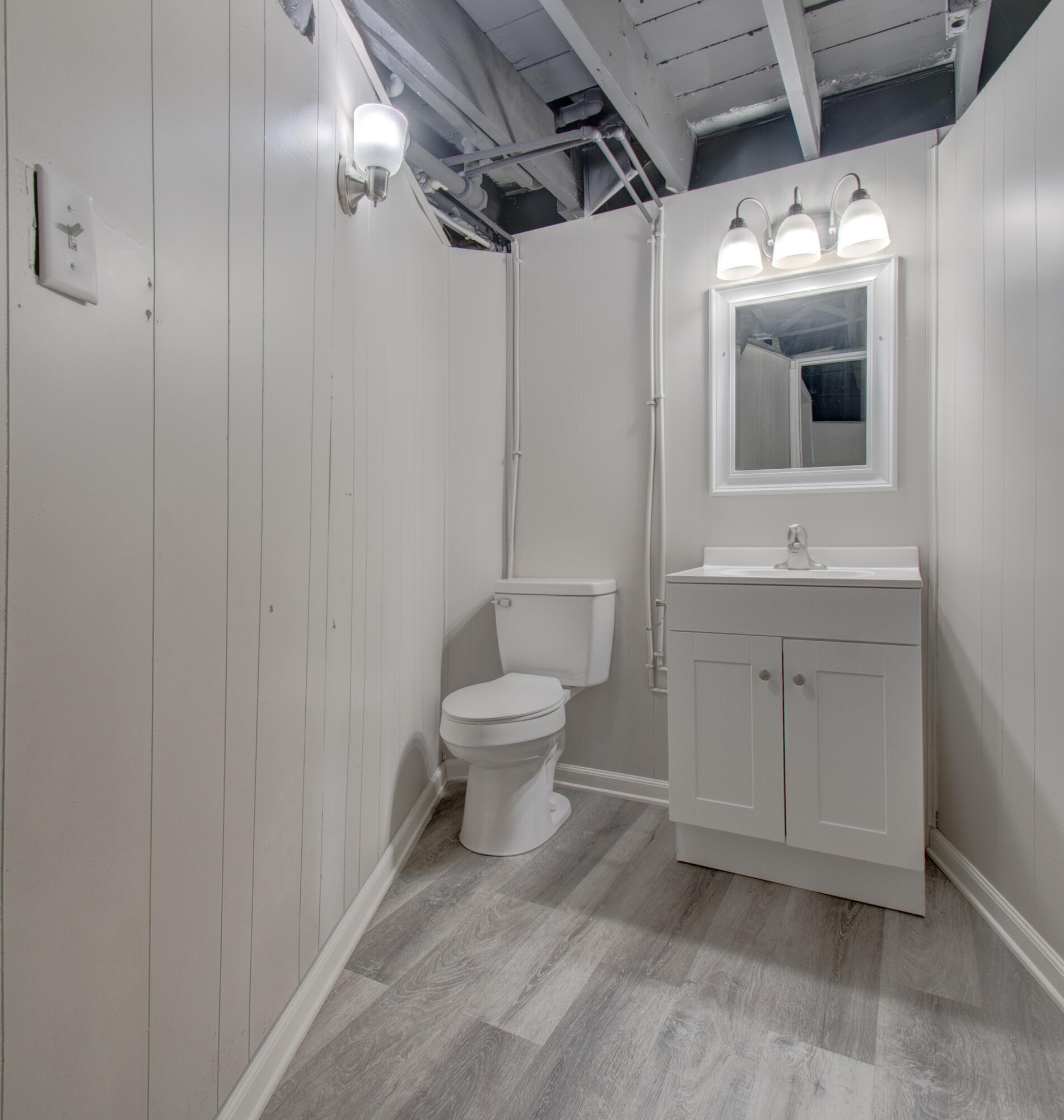 4727 Harrison Street Gary, IN 46408 - Photo 13 of 15 a bathroom with a toilet sink and mirror