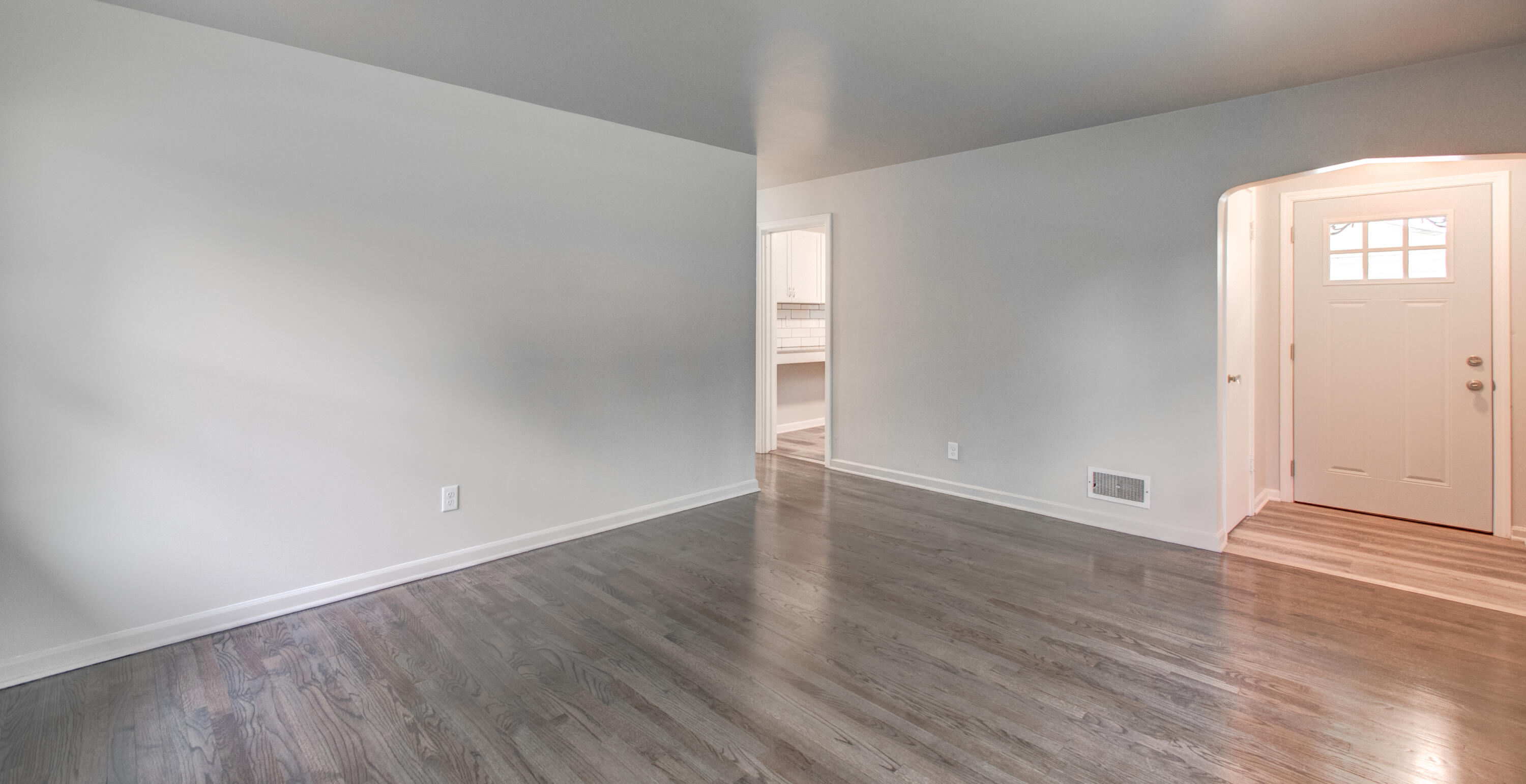 4727 Harrison Street Gary, IN 46408 - Photo 8 of 15 an empty room with wooden floor and windows