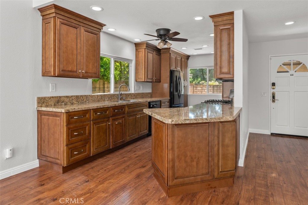 4346 Los Padres Drive Fallbrook, CA 92028 - Photo 14 of 33 a kitchen with granite countertop a sink cabinets and wooden floor