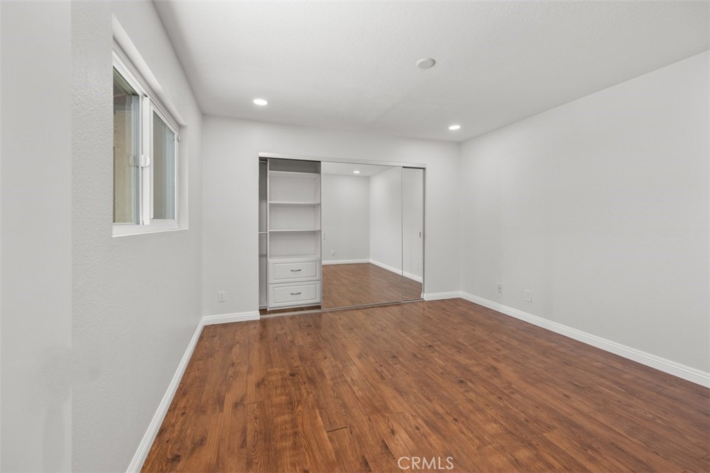 4346 Los Padres Drive Fallbrook, CA 92028 - Photo 14 of 31 a view of empty room with wooden floor and fan