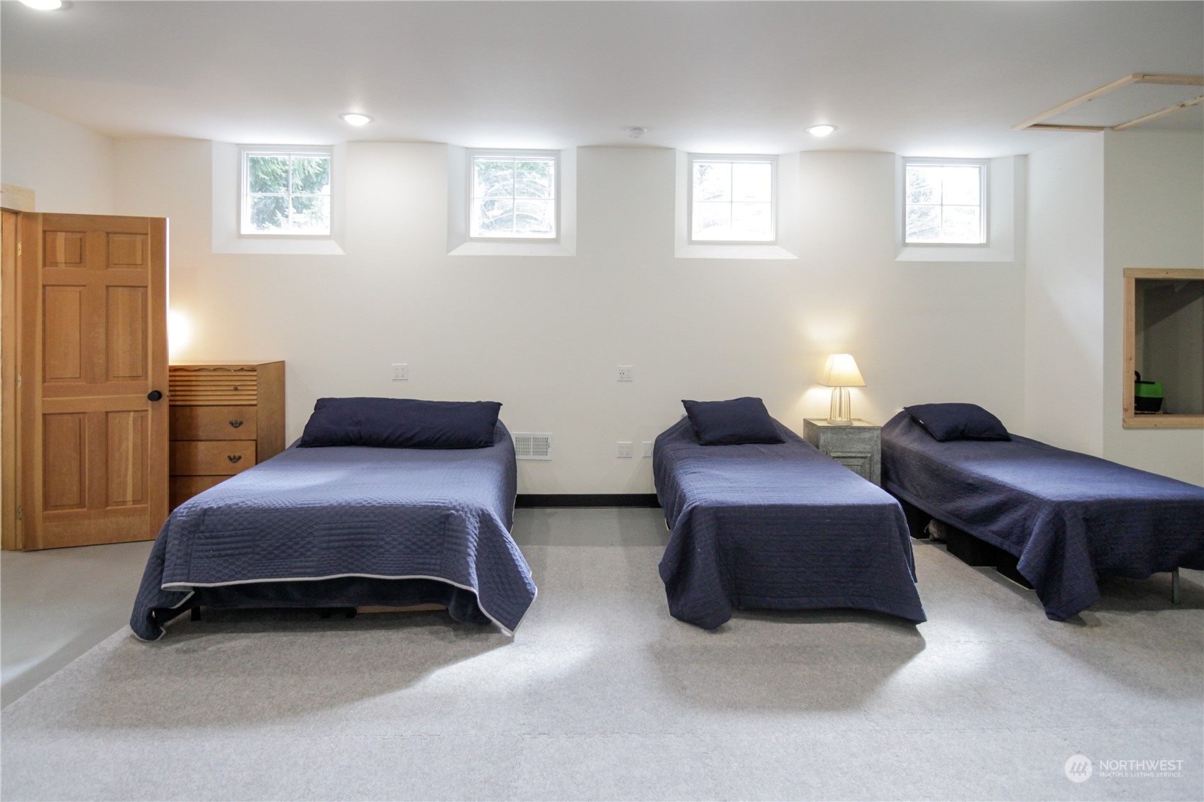 120 Swindler Road Winlock, WA 98596 - Photo 15 of 37 a bedroom with two beds and painting on the wall